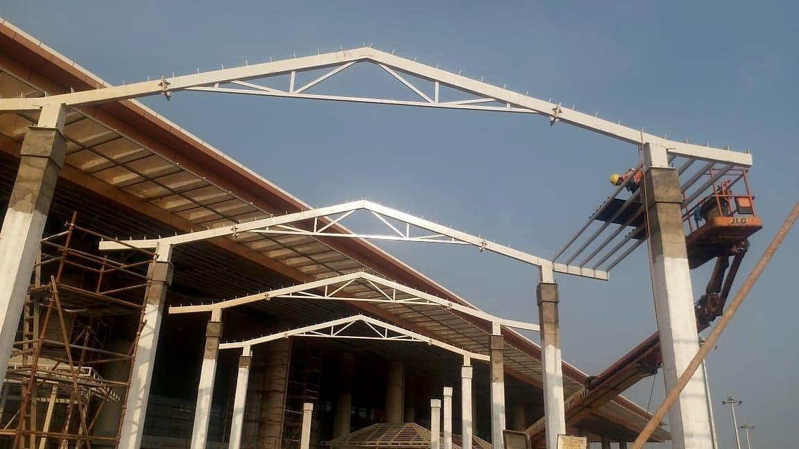 Steel roof trusses being erected over the terminal building at Manohar International Airport, Goa